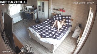 Her husband playing on the computer and she is lying naked on the bed