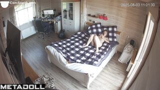 Her husband playing on the computer and she is lying naked on the bed