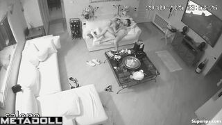 Two naked couples have intercourse in the living room while watching TV