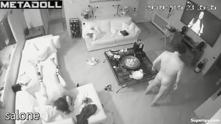 Two naked couples have intercourse in the living room while watching TV