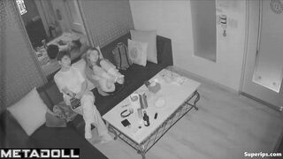 Young boyfriend kisses and caresses his Asian girlfriend in a karaoke room