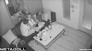 Young boyfriend kisses and caresses his Asian girlfriend in a karaoke room