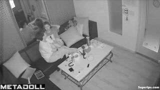 Young boyfriend kisses and caresses his Asian girlfriend in a karaoke room