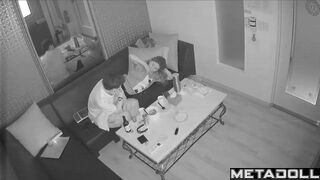 Young boyfriend kisses and caresses his Asian girlfriend in a karaoke room