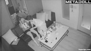 Young boyfriend kisses and caresses his Asian girlfriend in a karaoke room