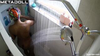 Young ebony girl caresses her sexy body while taking a shower