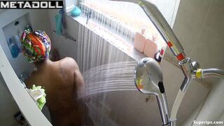 Young ebony girl caresses her sexy body while taking a shower