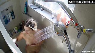 Young naked beauty relaxes and caresses her body in the shower