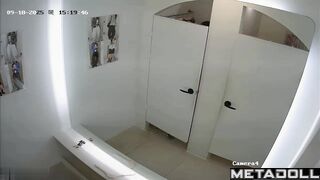 Asian beauties were trying on clothes in the fitting room