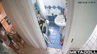 Brunette brushes her teeth and pees at the same time