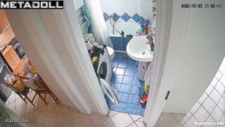 Brunette brushes her teeth and pees at the same time