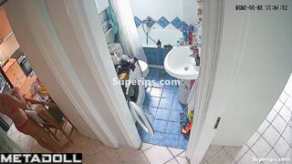 Brunette brushes her teeth and pees at the same time