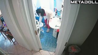 Young brunette peeing and brushing her teeth at the same time