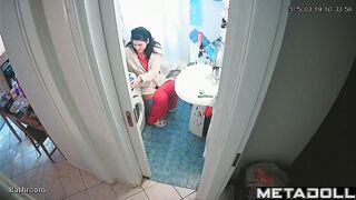 Young brunette peeing and brushing her teeth at the same time