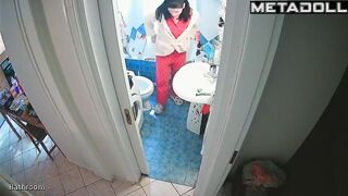 Young brunette peeing and brushing her teeth at the same time