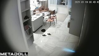 Romantic prelude between spouses, living room cam
