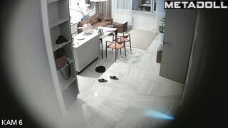 Romantic prelude between spouses, living room cam