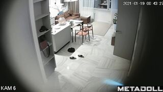 Romantic prelude between spouses, living room cam