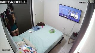 Brunette sat on the bed and recorded voice messages