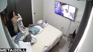 She was changing clothes and watching TV at the same time
