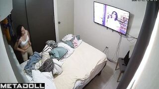 She was changing clothes and watching TV at the same time