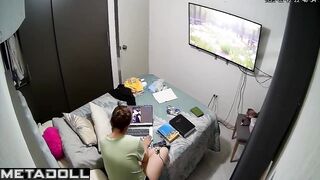 She is engrossed in looking at photos, home solo video