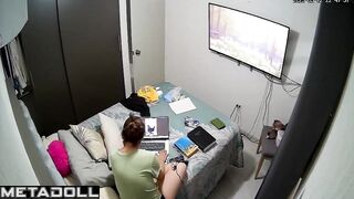 She is engrossed in looking at photos, home solo video