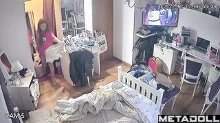 Redhead babe putting on clothes and watching TV (solo)