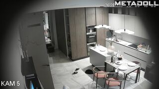 Horny husband kissing his naked wife in the living room