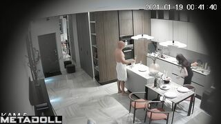 Horny husband kissing his naked wife in the living room