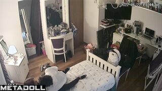 Teenagers petting and kissing in the closed bedroom