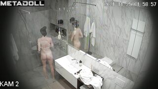 Skinny brunette relaxing in the shower stall, look