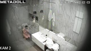 Skinny brunette relaxing in the shower stall, look