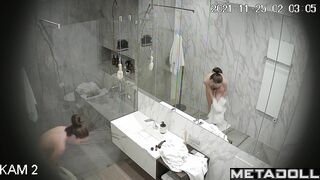 Skinny brunette relaxing in the shower stall, look