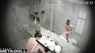 Skinny brunette relaxing in the shower stall, look