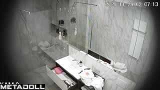 Skinny brunette relaxing in the shower stall, look