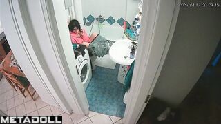 Serious phone conversation on the toilet, solo scene