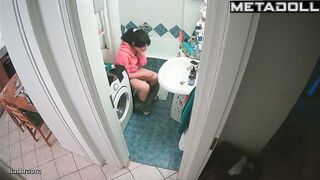 Serious phone conversation on the toilet, solo scene