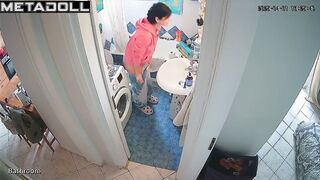Lady's relaxing on the toilet in funny pajamas, solo