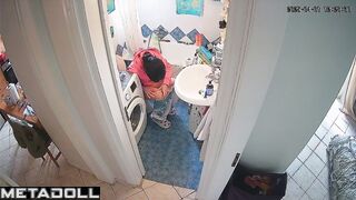 Lady's sitting on the toilet in funny pajamas, look