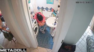 Lady's sitting on the toilet in funny pajamas, look
