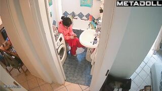 Brunette's sitting on the toilet in funny pajamas