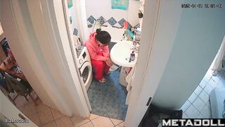 Brunette's sitting on the toilet in funny pajamas