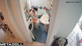 Slim brunette has a little time to sit on the toilet