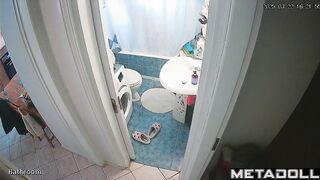 She enjoys taking a break from her family in the bathroom