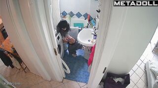 Brunette enjoys taking a break from her family in the toilet
