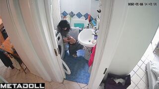 Brunette enjoys taking a break from her family in the toilet