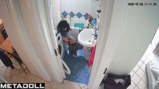 Brunette enjoys taking a break from her family in the toilet