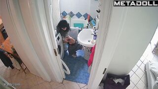 Brunette enjoys taking a break from her family in the toilet