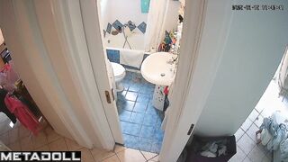 Brunette is in no hurry and sitting on the toilet